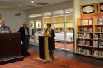 photo - Mayor Malcolm Brodie, left, and Philip Dayson listen as Shirley Barnett addresses the 50-plus people who attended the Nov. 18 event at Richmond Public Library that honored the Dayson family