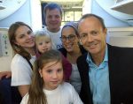 photo - The Hon. Stockwell Day, right, and International Fellowship of Christians and Jews of Canada senior vice-president Rabbi Yael Eckstein with a Ukrainian Jewish family who were among the 220 that the Fellowship brought to Israel on Sept. 29