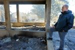 photo - Prime Minister Binyamin Netanyahu examines arson damage in Beit Meir