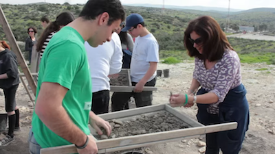 screenshot - “Every bucket could hold a treasure waiting to be discovered,” reads the caption in the brief video about Israel’s Beit Guvrin-Maresha National Park, where visitors can help with the excavations. As part of their trip to Israel, the Bagel Club will take part in the park’s Dig for a Day