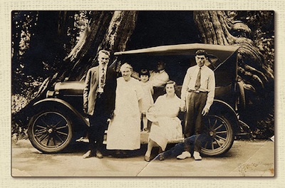 photo - Abraham Nemetz, Toba Nemetz, Esther Wosk, Bill Nemetz (driving), Chava Wosk holding baby Sonny, and Abrasha Wosk; taken at the hollow tree in Stanley Park, 1927