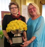 photo - Marie Doduck, left, receives the CHILD Foundation Inspiration Award from the foundation’s Mary McCarthy Parsons