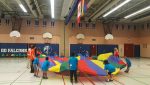 photo - Campers play with a parachute