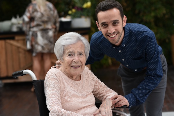 photo - Elad Pelleg and his grandmother, Dvora. Pelleg shared his family’s story during the community’s Yom Hazikaron ceremony May 7