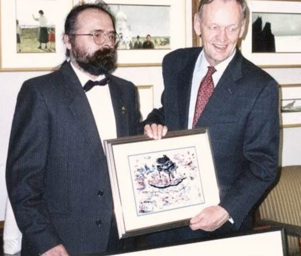 photo - Imre Székely, left, gives his artwork to then-prime minister Jean Chrétien