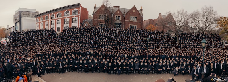 photo - Thousands of rabbis pose for a group photo in front of Chabad-Lubavitch world headquarters in Brooklyn, NY, on Dec. 1